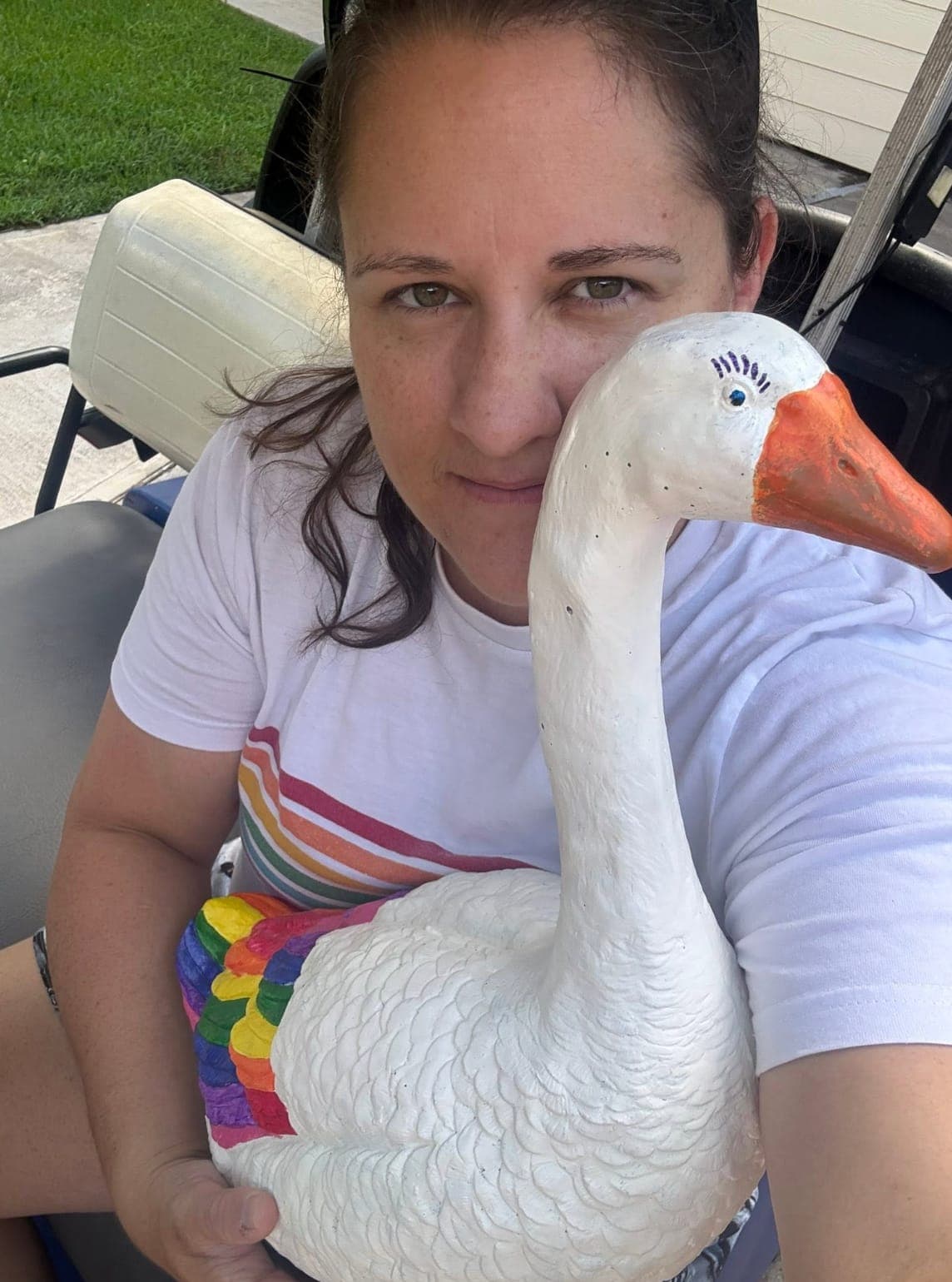 Gelso with her pride rainbow goose — a one-of-a-kind custom paint